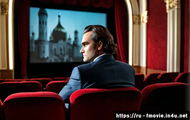 Home 17 호아킨 피닉스 출연작 - Photorealistic cinematic portrait of Joaquin Phoenix seated in a classic Moscow art-house cinema, th...